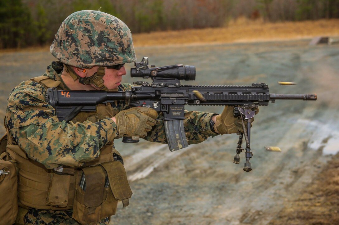 Lance Cpl. Frederick Gabourel, Bravo Company, Marine Barracks Washington D.C., fires an M27 Infantry Automatic Rifle during a live-fire drill as a part of a field trainging exercise aboard Marine Corps Base Quantico, Quantico, Virginia, Feb. 7, 2019.