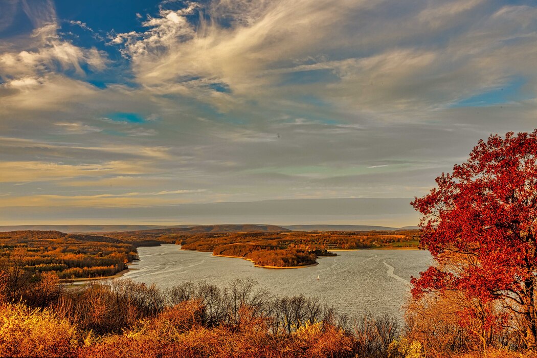 Image shows the Blue Marsh Lake reservoir during autumn with scenario in the background
