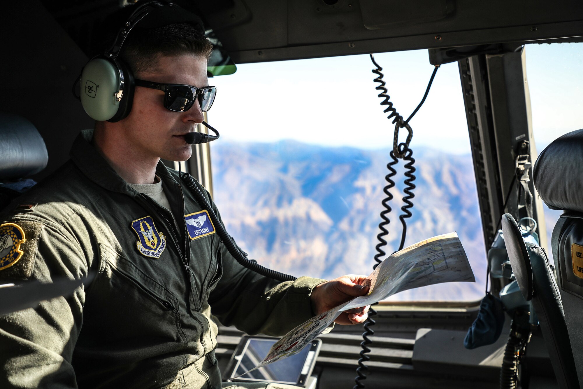 Second Lt. Eric Bainer, 89th Airlift Squadron C-17 pilot, provides navigational support during a low-altitude flying exercise at Naval Base Coronado, California, Jan. 22, 2019. Members of the 445th Airlift Wing Operations Group performed their annual training at Naval Amphibious Base, Coronado and Marine Corps Air Station Miramar near San Diego, California Jan. 18-27, 2019. The training included water survival, Survival, Evasion, Resistance and Evasion, and low altitude flying. (U.S. Air Force photo/Master Sgt. Patrick O’Reilly)