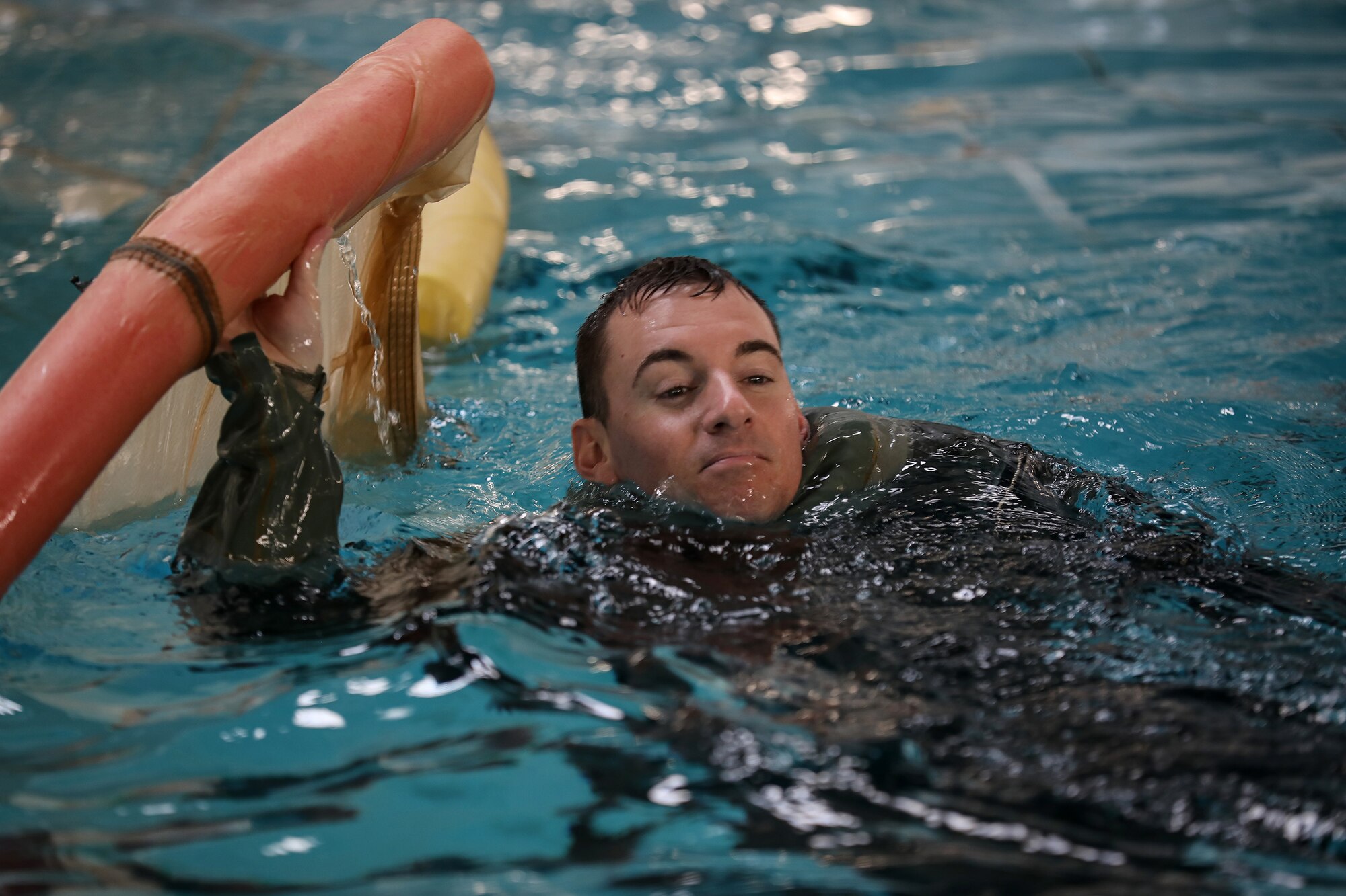 Staff Sgt. Steven Murphy, 89th Airlift Squadron loadmaster, participates in water survival training Jan. 25, 2019. Members of the 445th Airlift Wing Operations Group performed their annual training at Naval Amphibious Base, Coronado and Marine Corps Air Station Miramar near San Diego, California Jan. 18-27, 2019. The training included water survival, Survival, Evasion, Resistance and Evasion, and low altitude flying. (U.S. Air Force photo/Master Sgt. Patrick O’Reilly)