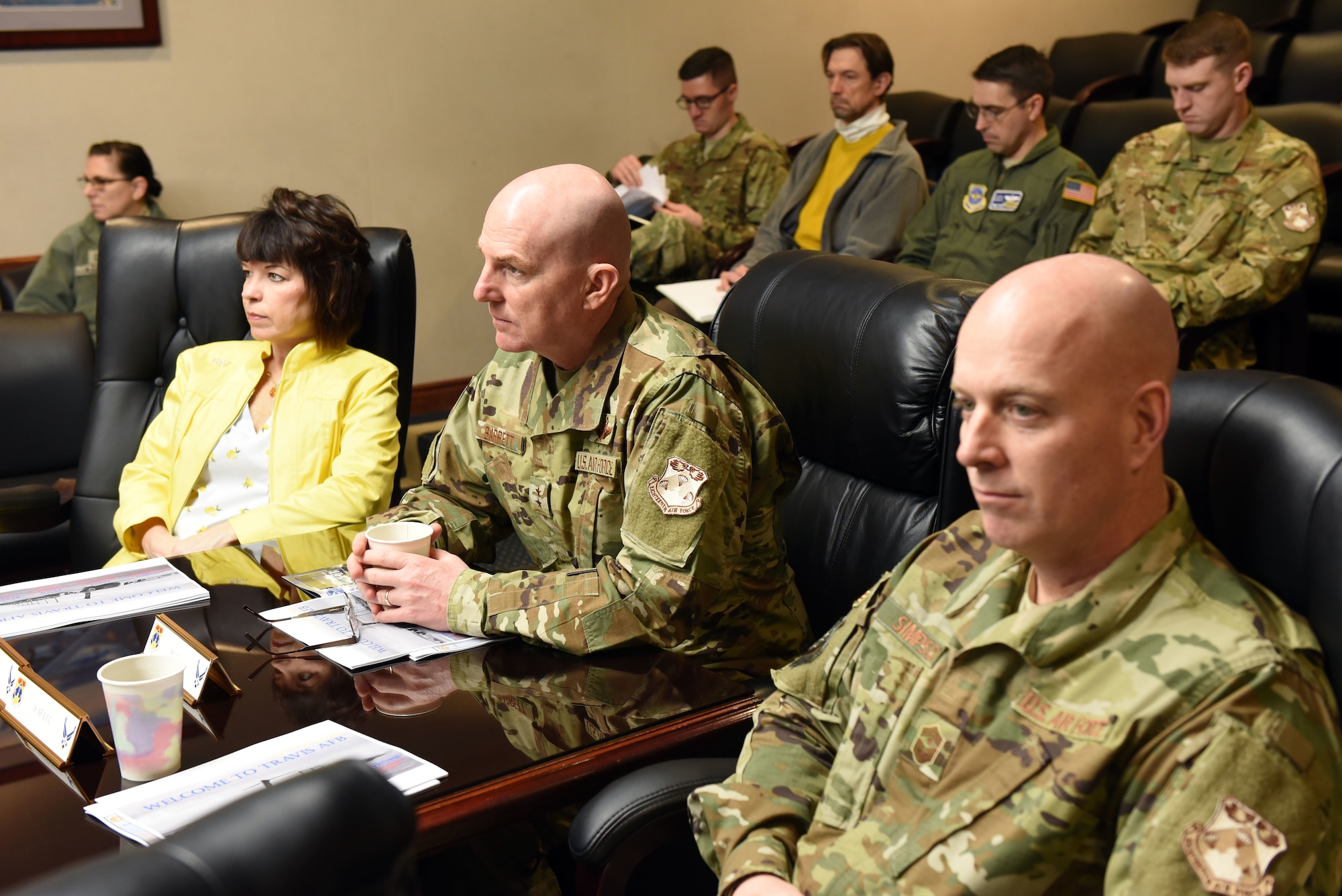 U.S. Air Force Chief Master Sgt. Chris Simpson, 18th Air Force command chief, right, U.S. Air Force Maj. Gen. Sam Barrett, 18th AF commander, center, and his wife, Kelly, left, meet with leadership members of Travis Air Force Base, California, during a visit to the base March 5, 2019. The trio joined Travis leadership in touring the base March 4 to 8 as part of a scheduled visit. (U.S. Air Force photo by Airman 1st Class Christian Conrad)