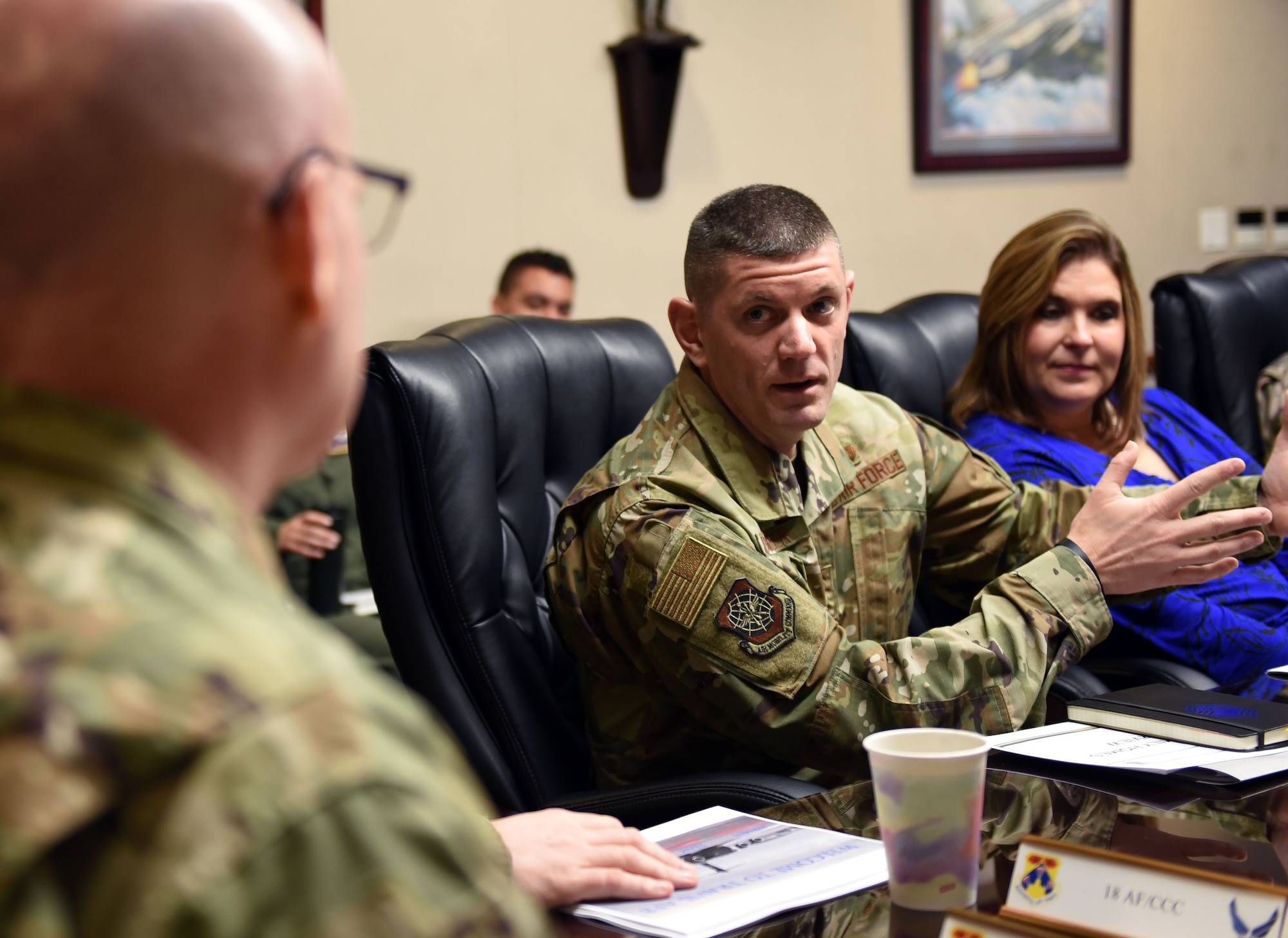 U.S. Air Force Chief Master Sgt. Derek Crowder, 60th Air Mobility Wing command chief, briefs U.S. Air Force Maj. Gen. Sam Barrett, 18th Air Force commander, during a visit to Travis Air Force Base, California, March 5, 2019. Barrett, along with his wife, Kelly and U.S. Air Force Chief Master Sgt. Chris Simpson, 18th Air Force command chief, toured the base March 4 to 8 as part of a scheduled visit. (U.S. Air Force photo by Airman 1st Class Christian Conrad)