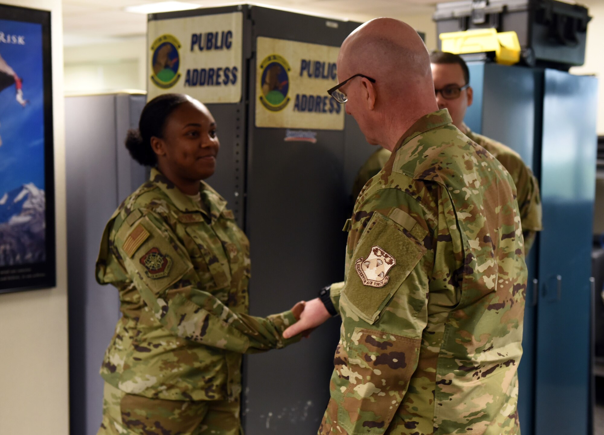 U.S. Air Force Maj. Gen. Sam Barrett, 18th Air Force commander, presents a coin to star performer U.S. Air Force Senior Airman Jacqueline Watkins, 60th Communications Squadron client systems technician, during a visit to Travis Air Force Base, California, March 5, 2019. Barrett, along with his wife, Kelly and U.S. Air Force Chief Master Sgt. Chris Simpson, 18th Air Force command chief, toured the base March 4 to 8 as part of a scheduled visit. (U.S. Air Force photo by Airman 1st Class Christian Conrad)