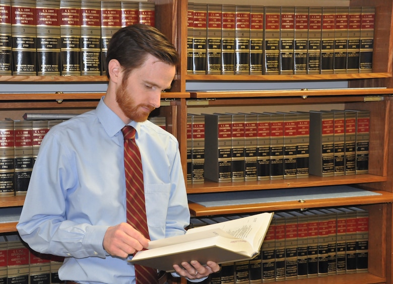 Phillip Paradise, assistant district counsel, U.S. Army Corps of Engineers – Savannah District, reviews a point of law in the Savannah District counsel’s library. Paradise and three other Savannah District attorneys are alumni of the U.S. Army Corps of Engineers Office of the Chief Counsel Civilian Honors Program.