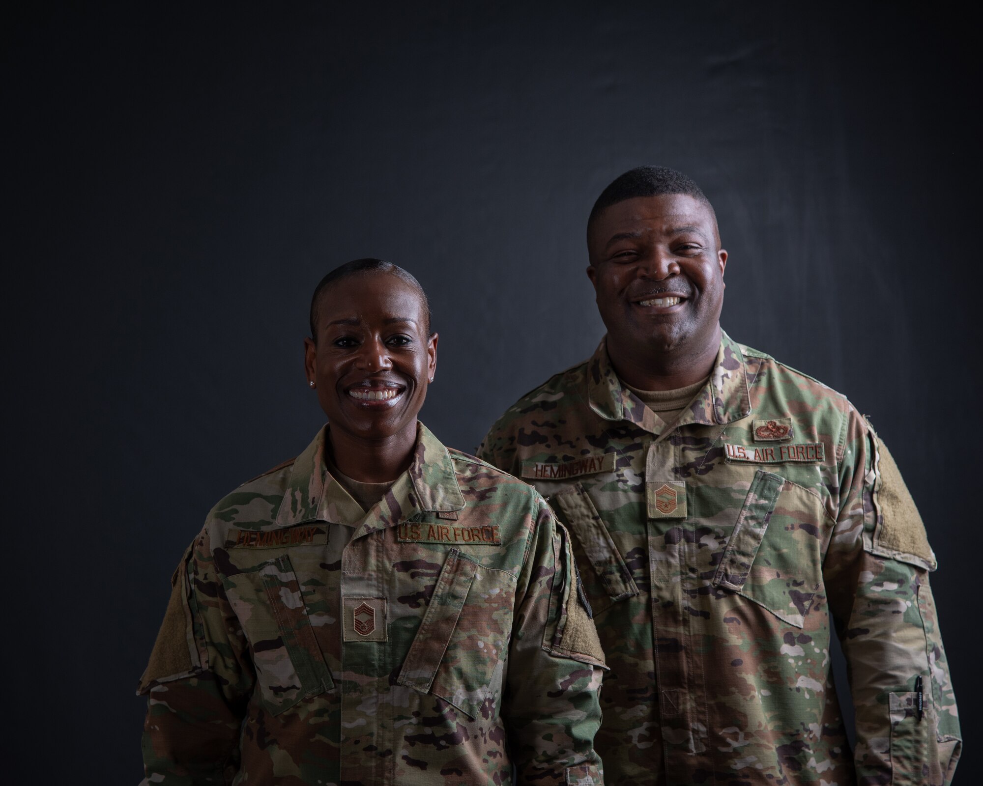 Chief Master Sergeant Rochelle Hemingway, 56th Aerospace Medicine Squadron superintendent, stands with her husband, Chief Master Sergeant Dominic Hemingway, 56th Maintenance Group superintendent.  They have weathered the ups and downs that come with any demanding job and cheered each other on through the ranks as they climbed to the top one percent of the enlisted force. (U.S. Air Force photo by A1C Aspen Reid)