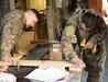 U.S. Army Medic Spc. Dalton Chatwell supervises Pfc. Jacob Chavez while making litter racks at Bagram Air Field, Afghanistan, March 3, 2019. The medics reorganized their workspace space by making racks in the wood shop in order to have more room.
