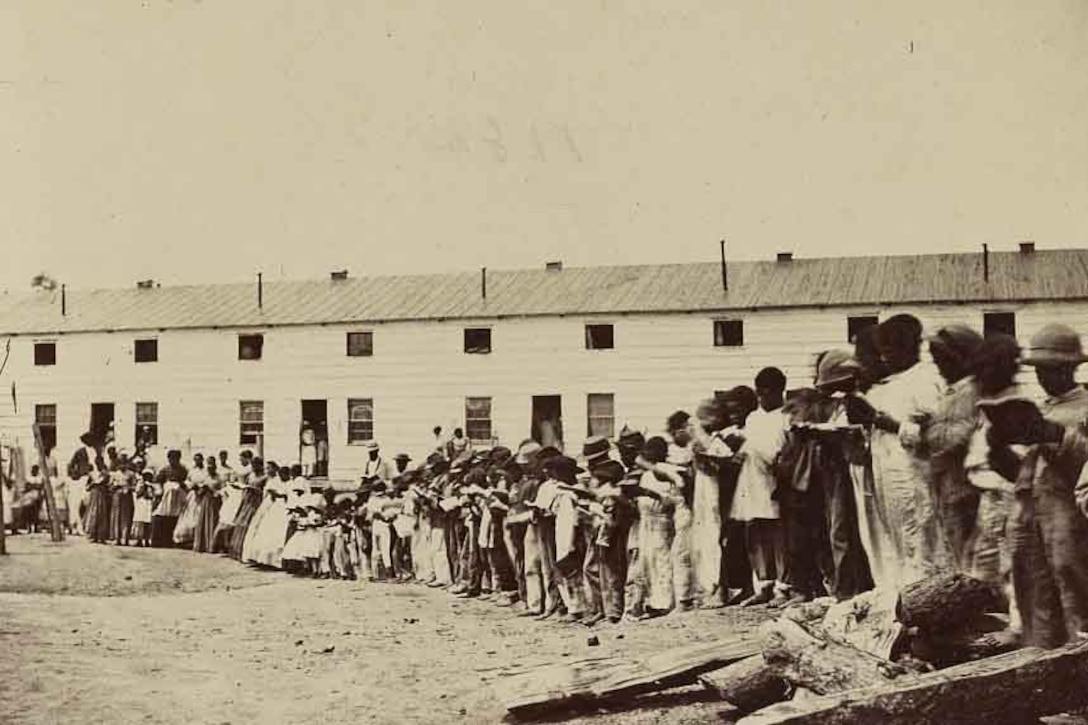 Freed slaves stand in line.