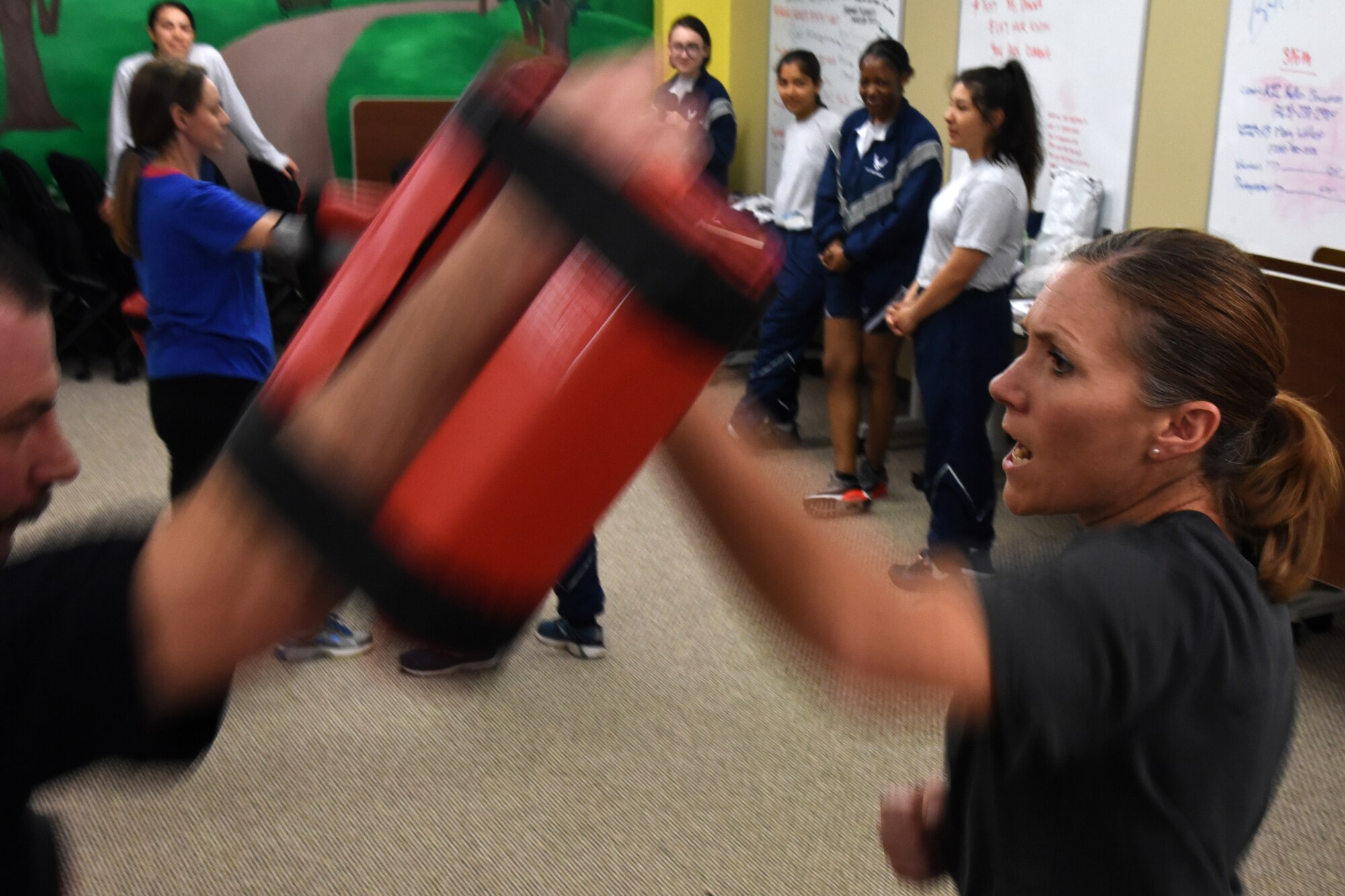 RaNay Conrow, an Air Force dependent, practices blocking an aggressor, which for training purposes is an arm pad, during a women’s self-defense class in the Goodfellow Resiliency Center, at Goodfellow Air Force Base, Texas, March 8, 2019. Fifteen women attended the event. (U.S. Air Force photo by Airman 1st Class Abbey Rieves/ Released)