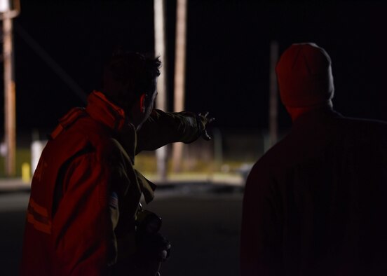 A member of the 30th Civil Engineer Squadron fire department shows Jim Lewis, 30th Space Wing Safety Office safety and health specialist of pad and missile, the launch facility after launch Feb. 5, 2019 at Vandenberg Air Force Base, Calif. Lewis’s job requires him to follow the first responders to the launch and to give back the keys of the facility. (U.S. Air Force photo by Airman 1st Class Aubree Milks)