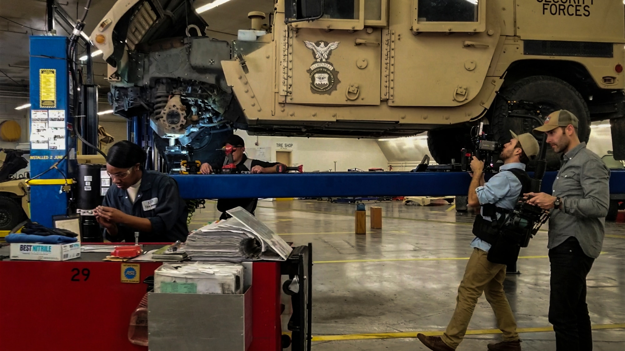 Members of the Profession of Arms Center of Excellence team film members of the 377th Logistics Readiness Squadron, vehicle maintenance, at Kirtland Air Force Base, N.M., March 6, 2019.  The PACE crew was here to allow Team Kirtland to be part of their Heritage Today Program video series. (U.S. Air Force photo by Airman 1st Class Austin J. Prisbrey)