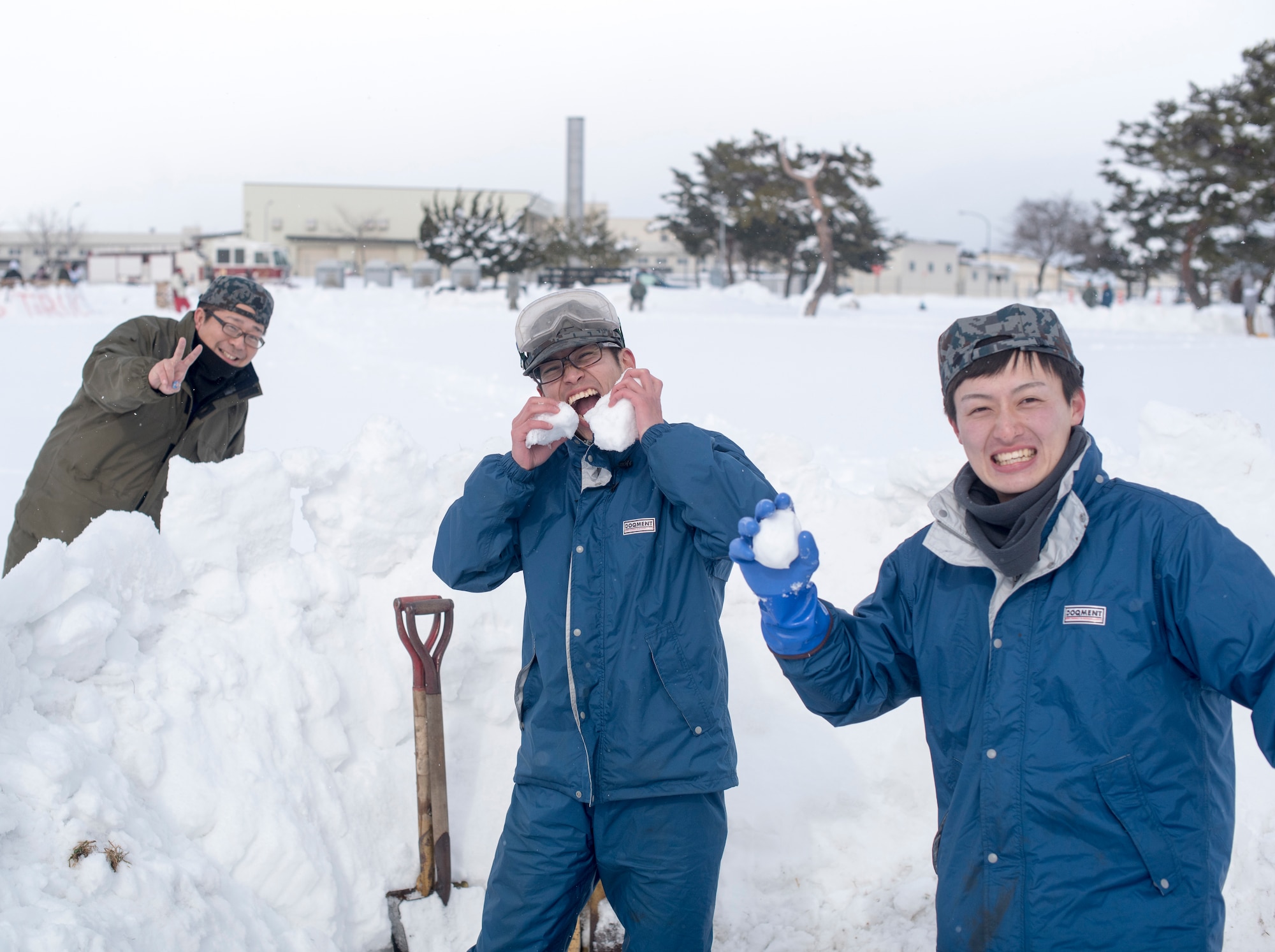Members with the Japan Air Self-Defense Force pause for a photo during the inaugural “Snowblast” event at Misawa Air Base, Japan, Feb. 14, 2019. The JASDF were the first to show up to the event and build their fortress. They participated in the snowball fight and tied with the explosive ordnance disposal and infrastructure flights during the capture the flag event. The afternoon afforded them an opportunity for members to boost morale and build international relationships. (U.S. Air Force photo by 1st Lt. Jeremy Garcia)