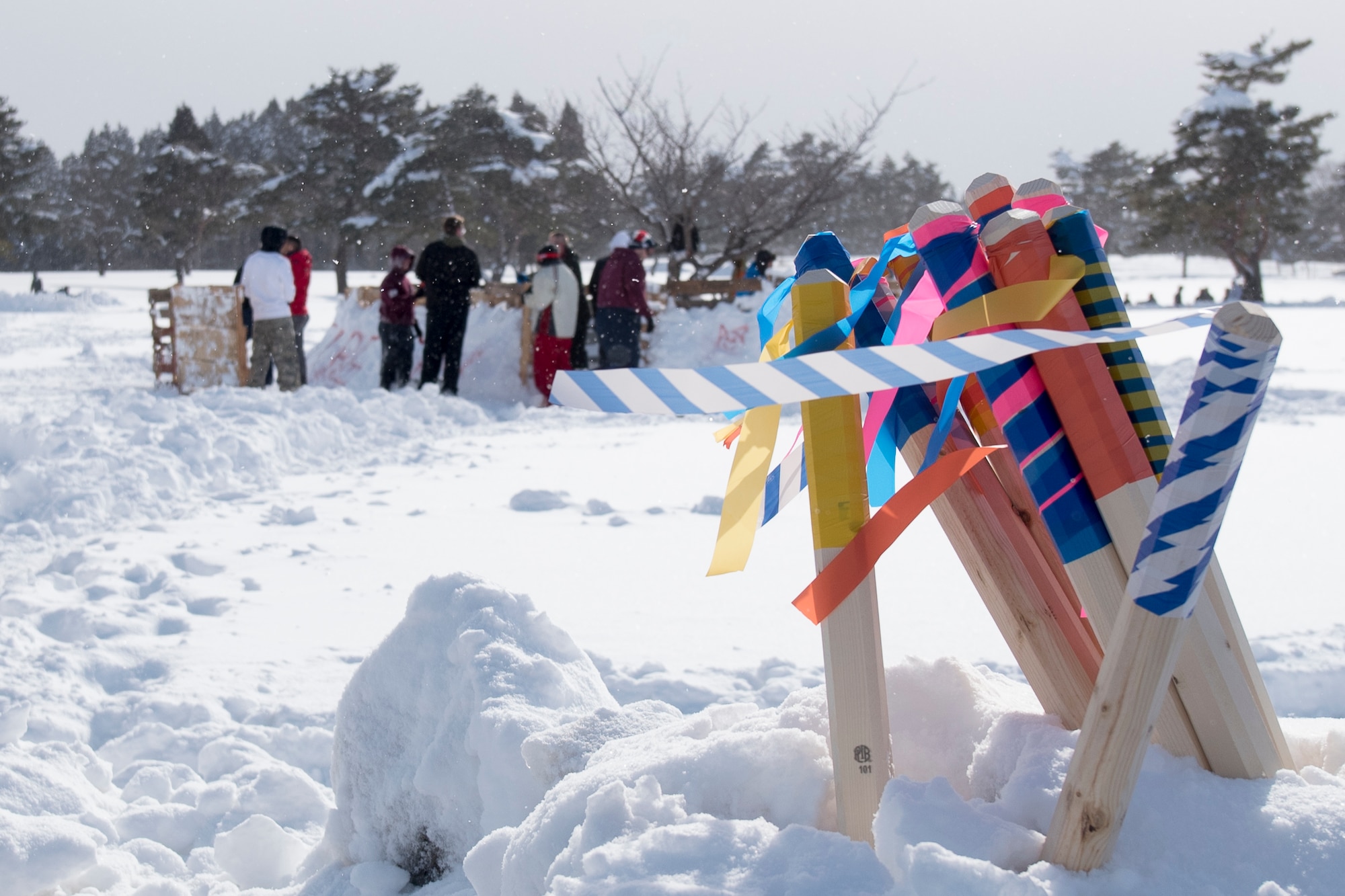 The flags get planted in the snow to represent the 35th Civil Engineer Squadron flights who participated in the inaugural “Snowblast” event at Misawa Air Base, Japan, Feb. 14, 2019. Members of each flight attempted to capture the opponent’s flag rested from fortress. The event ended in a three-way tie between infrastructure, explosive ordnance disposal, and the Japan Air Self-Defense teams. (U.S. Air Force photo by 1st Lt. Jeremy Garcia)