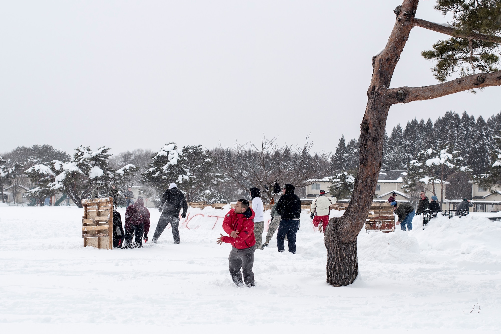 U.S. Air Force 35th Civil Engineer Squadron Airmen gather for the inaugural “Snowblast” event at Misawa Air Base, Japan, Feb. 14, 2019. Members with the Japan Air Self-Defense Force participated in the event creating their own fortress, preparing to win the snowball and capture the flag challenges. (U.S. Air Force photo by 1st Lt. Jeremy Garcia)
