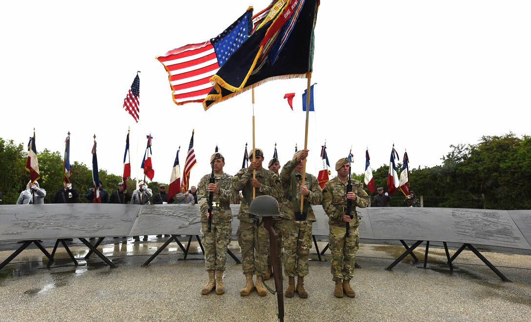 The 75th Ranger Regiment Color Guard posts the colors during the Pointe du Hoc Ranger Monument commemoration ceremony