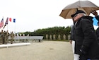 U.S. Navy D-Day veteran John T. Siewert stands to be recognized during the Pointe du Hoc Ranger Monument commemoration ceremony