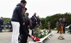 U.S. Navy D-Day veteran John T. Siewert places a wreath at Pointe du Hoc, France