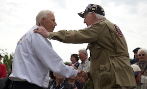 World War II Veterans Richard Yates and Ernie Lamson embraces one another in Amfreville, France