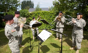 The U.S. Army Europe Band and Chorus plays at a ceremony in Amfreville, France