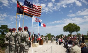 82nd Airborne Division Soldiers present the Colors at a ceremony in Amfreville, France