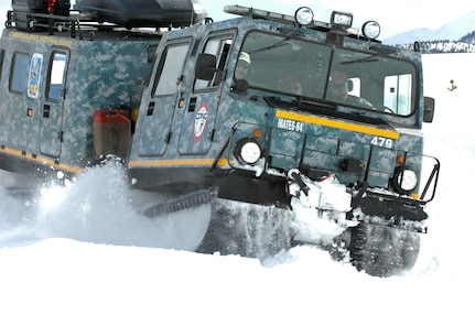 A Small Unit Support Vehicle, featuring emergency lights and digital camouflage, claws its way through the snow at Taylor Park Reservoir near Gunnison, Colo., March 15, 2010. The SUSV, which is capable of traversing almost any terrain, is the primary vehicle used by the Colorado Army National Guard’s Snow Response Team.