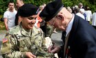 Sgt. Shirly Ortiz-Gomez with British Army veteran Royston O’Neill in Tournieres, France