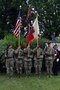 The 82nd Airborne Division colour guard in Gourbesville, France