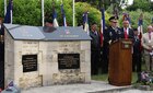 Maj. Gen. Mark Palze at a ceremony in Gourbesville, France