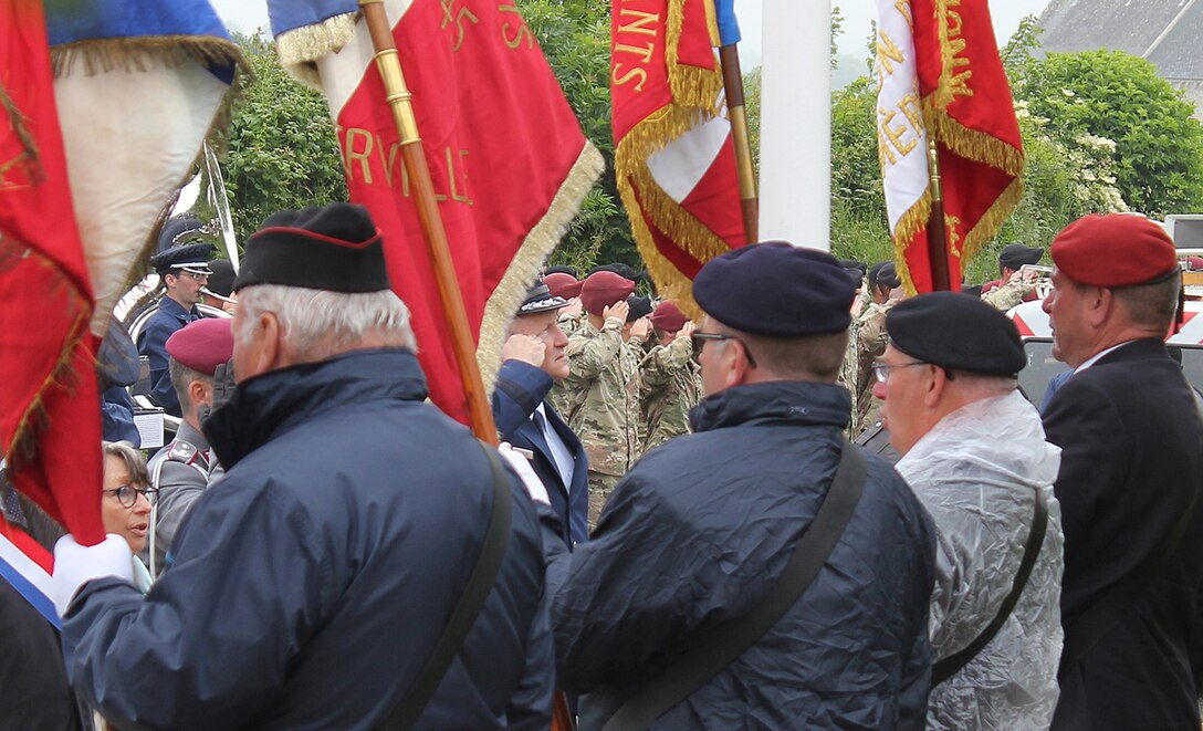 Brig. Gen. John D. Slocum and French officials in Foucarville, France
