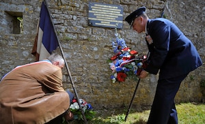 U.S. Air Force Brig. Gen. Patrick X. Mordente lays a wreath at a memorial in Coigny, France