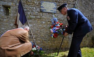 U.S. Air Force Brig. Gen. Patrick X. Mordente lays a wreath at a memorial in Coigny, France