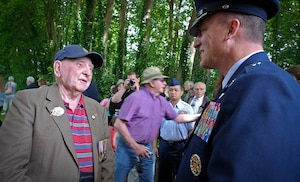 Eric Sissons, Royal Air Force World War II veteran, tells his story to Brig. Gen. Patrick X. Mordente in Coigny, France