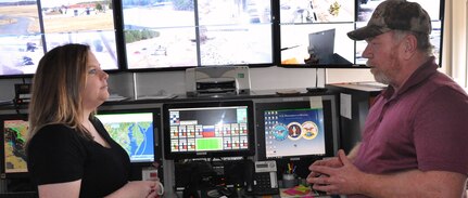 IMAGE: DAHLGREN, Va. (March 4, 2019) - Jennifer Ferrell - administrative lead for the Test and Evaluation Division at Naval Surface Warfare Center Dahlgren Division (NSWCDD) - listens intently as Donnie Preston, NSWCDD Potomac River Test Range (PRTR) Operations Center senior technician, briefs her on range operations. Ferrell is responsible for financial and human resources actions and financial management of the division, including PRTR. "The faster we can get funds properly in place, the faster we can execute the technical work to get the products delivered to the warfighter," said Ferrell. "I find pride in knowing that even though my role is non-technical, I can still make an impact to our warfighters by promoting more efficient financial and human resources policies and processes."