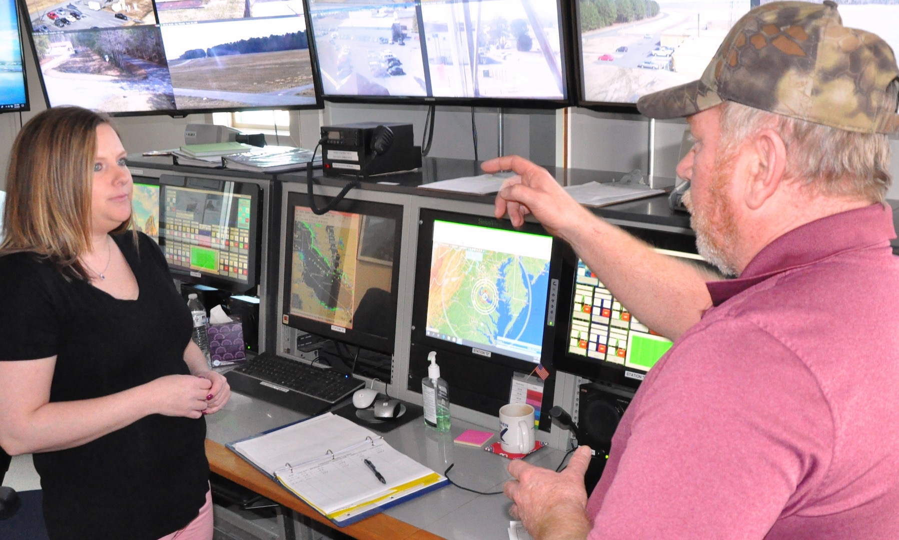 IMAGE: DAHLGREN, Va. (March 4, 2019) - Jennifer Ferrell - administrative lead for the Test and Evaluation Division at Naval Surface Warfare Center Dahlgren Division (NSWCDD) - listens intently as Donnie Preston, NSWCDD Potomac River Test Range (PRTR) Operations Center senior technician, briefs her on range operations. Ferrell is responsible for financial and human resources actions and financial management of the division, including PRTR. "The faster we can get funds properly in place, the faster we can execute the technical work to get the products delivered to the warfighter," said Ferrell. "I find pride in knowing that even though my role is non-technical, I can still make an impact to our warfighters by promoting more efficient financial and human resources policies and processes."
