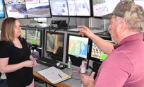 IMAGE: DAHLGREN, Va. (March 4, 2019) - Jennifer Ferrell - administrative lead for the Test and Evaluation Division at Naval Surface Warfare Center Dahlgren Division (NSWCDD) - listens intently as Donnie Preston, NSWCDD Potomac River Test Range (PRTR) Operations Center senior technician, briefs her on range operations. Ferrell is responsible for financial and human resources actions and financial management of the division, including PRTR. "The faster we can get funds properly in place, the faster we can execute the technical work to get the products delivered to the warfighter," said Ferrell. "I find pride in knowing that even though my role is non-technical, I can still make an impact to our warfighters by promoting more efficient financial and human resources policies and processes."
