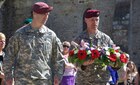 Maj. Jason Wayne and Maj. Rusty Topf of the 25th Infantry Brigade Combat Team at a ceremony in Hemevez, France