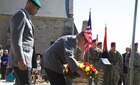 German Army officers lay a wreath at a ceremony in Hemevez, France