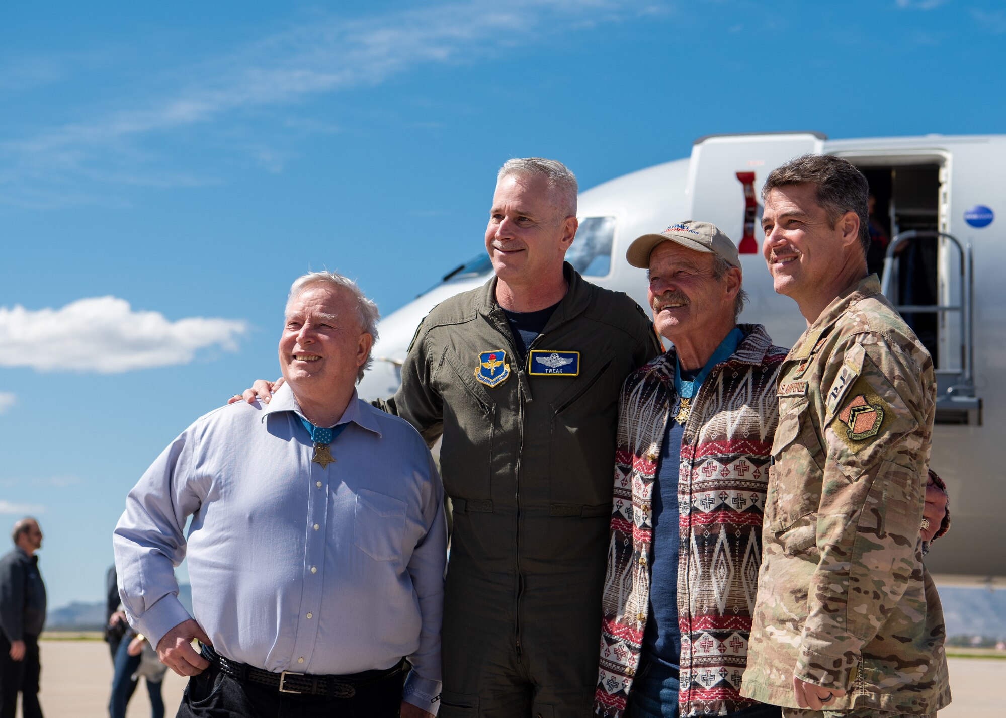 Medal of Honor recipients Donald Ballard and John Baca pose for a photo with Col. Michael Richardson, 56th Fighter Wing vice commander and Chief Master Sgt. Ronald Thompson, 56th FW command chief, March 8, 2019 at Luke Air Force Base, Ariz.
