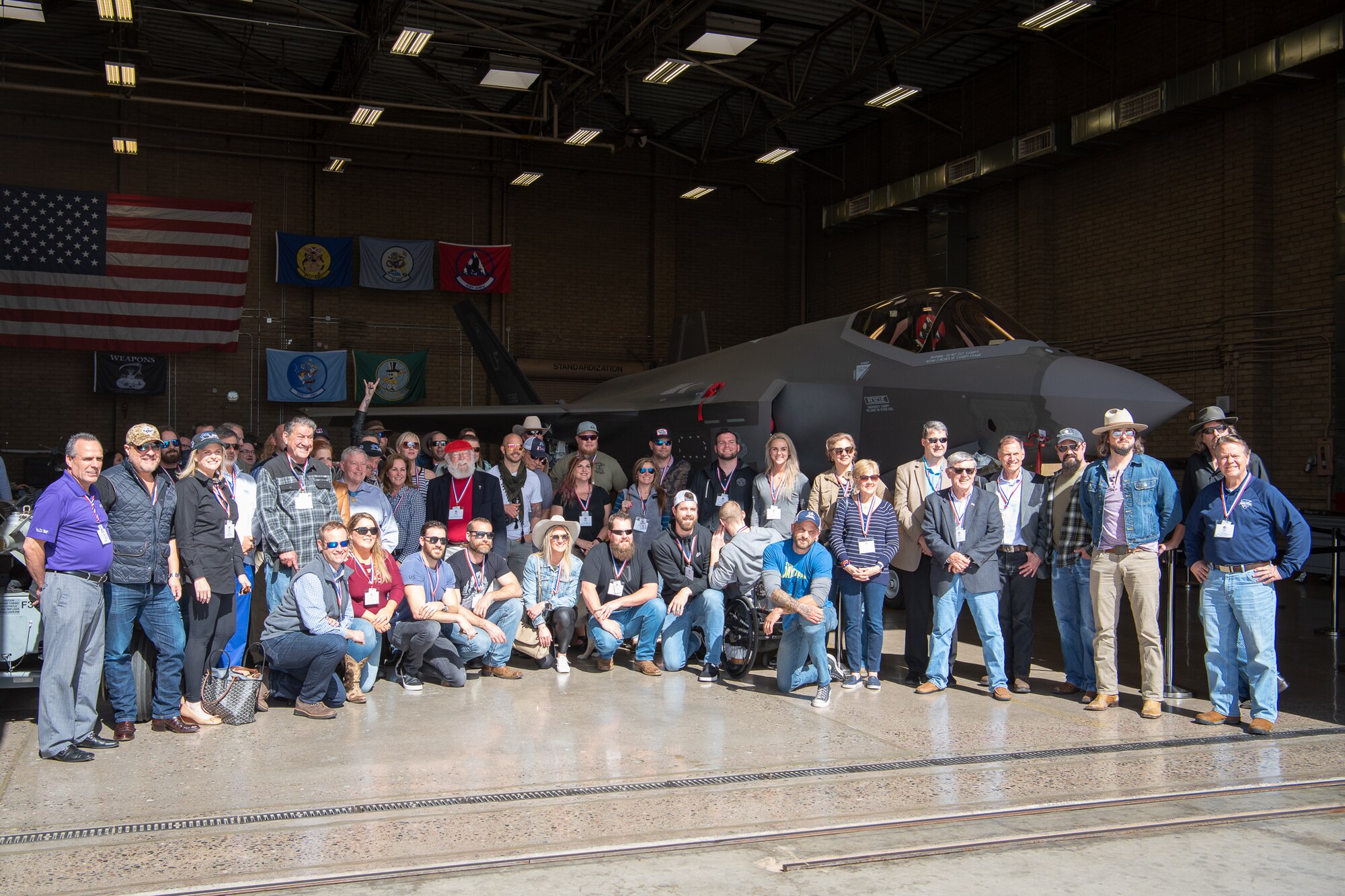 Members of the Airpower Foundation pose for a group photo in front of an F-35A Lightning II, March 8, 2019 at Luke Air Force Base, Ariz.