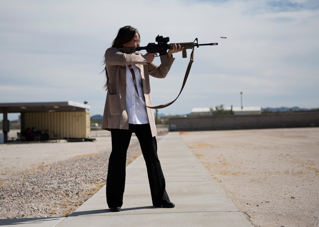 Valerie Berube, community partnerships director at Luke Air Force Base, fires a rifle at the Maricopa County Sheriff’s Office Firing Range in Buckeye, Ariz., Feb. 25, 2019.