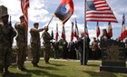 The 29th Infantry Division Color Guard renders honors during a ceremony near Hemevez, France