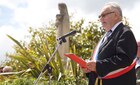 The Mayor of Negreville speaks during a ceremony in Negreville, France