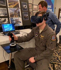 First Lt. Spencer Teiken from the 80th Operational Support Squadron at Sheppard Air Force Base, Texas, works through a virtual simulation problem during the Pilot Training Next Technology Expo at Joint Base San Antonio-Randolph March 12. Technology currently being used at PTN was on display at the expo and subject matter experts and technology vendors were available to talk with attendees.