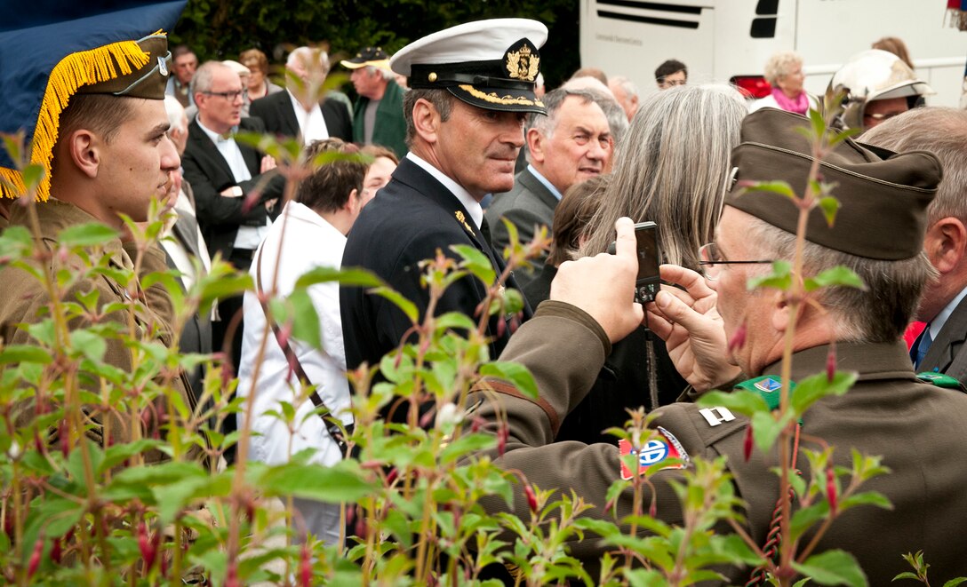 Multinational Soldiers and civilians in a ceremony in Graignes, France