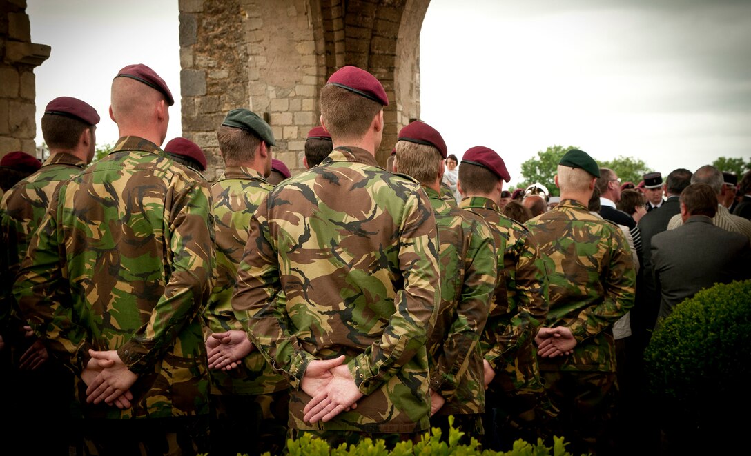 Soldiers participate in a ceremony in Graignes, France