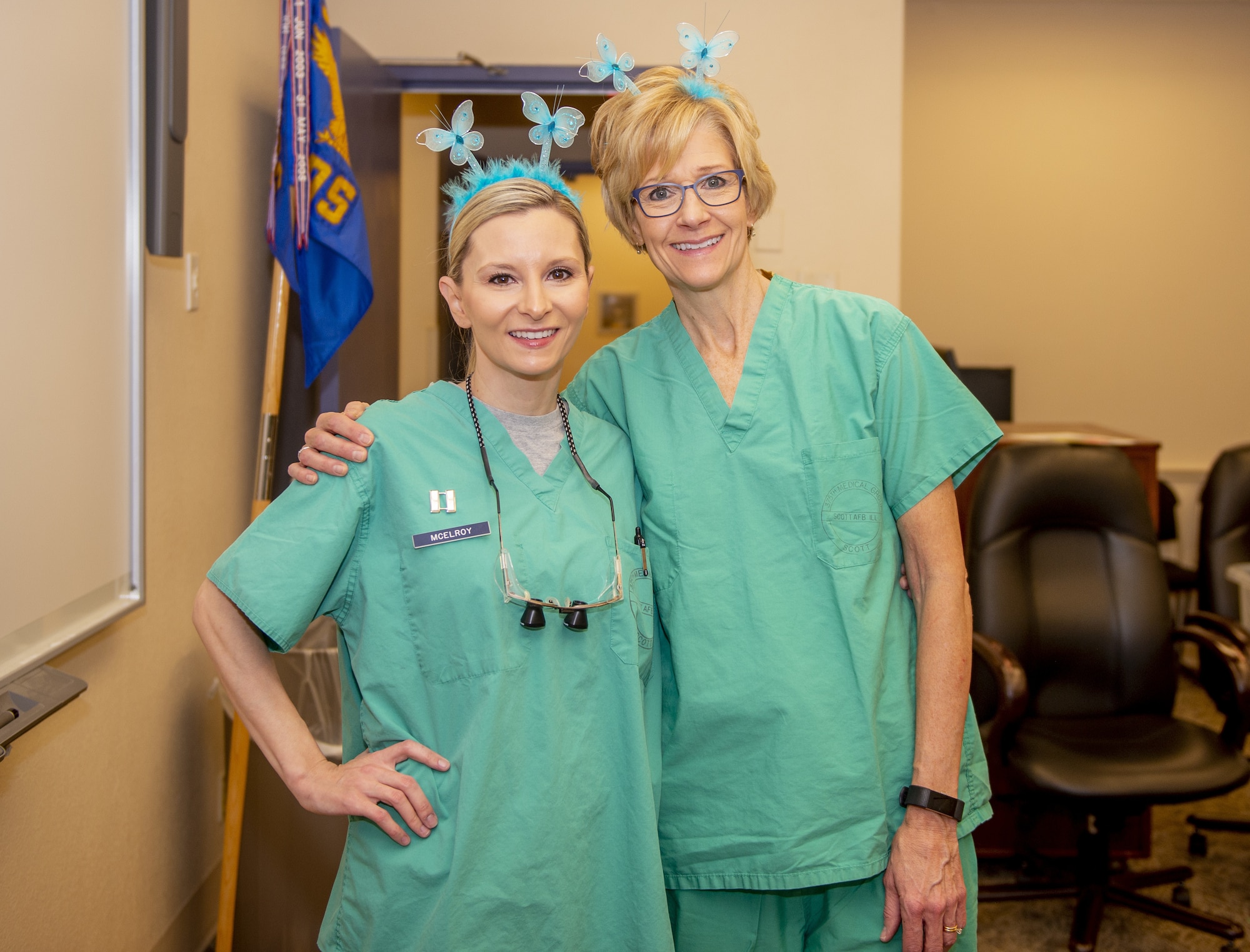 Capt. Kristi McElroy, 375th Dental Squadron general dentist, and Virginia Bennett, Chief of Preventive Dentistry, set aside a moment for a photo following the kickoff of the “Give Kids a Smile” day event March 9, 2019, held by Scott Air Force Base, Illinois.  Bennett and McElroy were both vital to the planning of the event as well as personally providing treatment to the children who attended.   (U.S. Air Force photo by Airman 1st Class Isaiah Gonzalez)