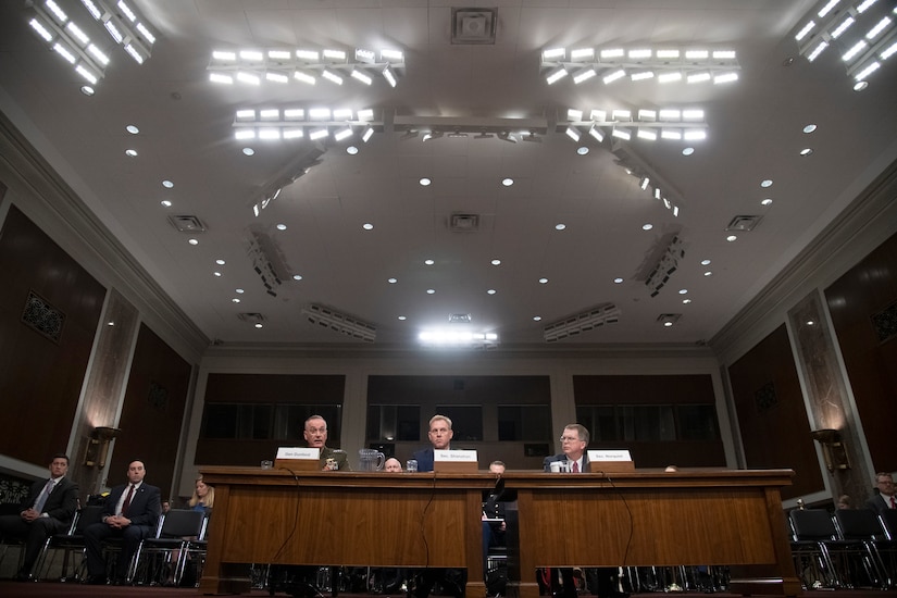 Marine Corps Gen. Joe Dunford, Acting Defense Secretary Patrick M. Shanahan and David L. Norquist sit at a table.