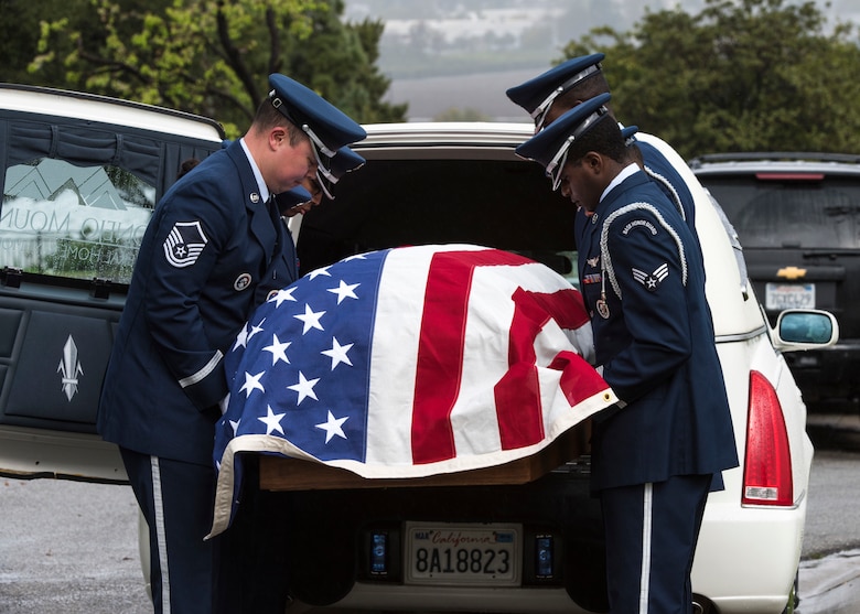 Vandenberg Honor Guard pallbearers remove a casket from a hearse during a U.S. Air Force active duty funeral March 2, 2019, in Camarillo, Calif. During a veteran’s funeral, six guardsmen are assigned to be pallbearers, who carry the casket, as well as fold the flag for next-of-kin. (U.S. Air Force photo by Airman 1st Class Aubree Milks)