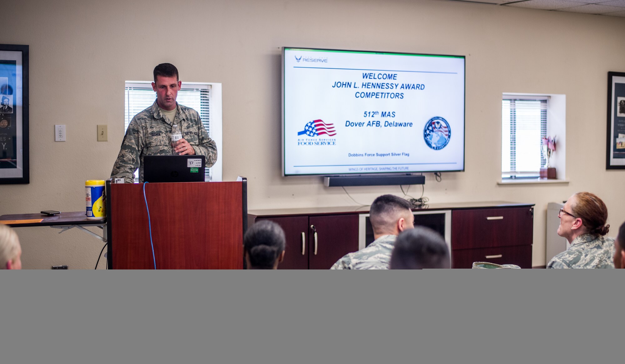 Members of the 512th Memorial Affairs Squadron attend an in-brief during the 2019 John L. Hennessy competition at Dobbins Air Reserve Base, Georgia, March 8, 2019. The 512th MAS was one of four Air Force Reserve Command units chosen to participate in the event. (U.S. Air Force photo by Staff Sgt. Damien Taylor)