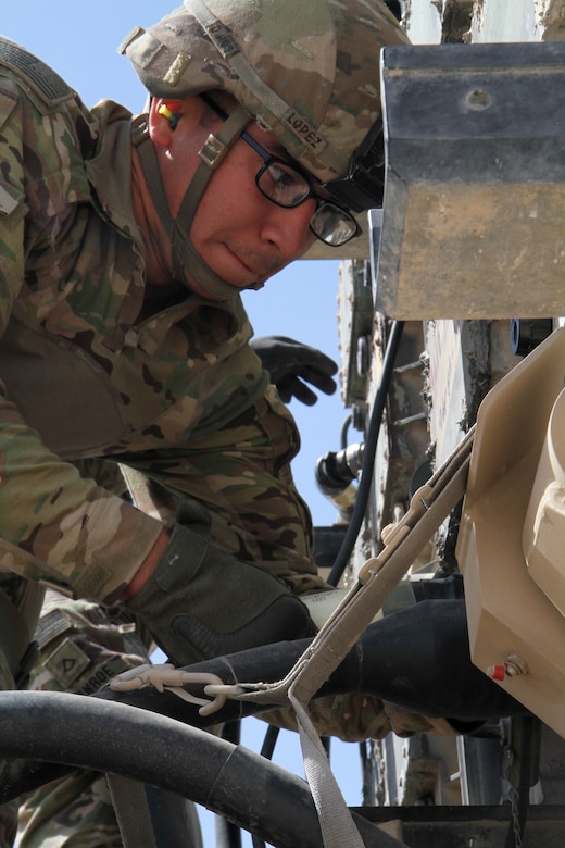 Army Cpl. Joe Lopez, a squad leader with Battery C, 1st Battalion, 43rd Air Defense Artillery Regiment, unhooks cables prior to completing a Patriot missile reload March 7, 2019. The Soldiers continually train and conduct battle drills to ensure they are able to perform their duty in providing air defense support across the U.S. Central Command area of responsibility.