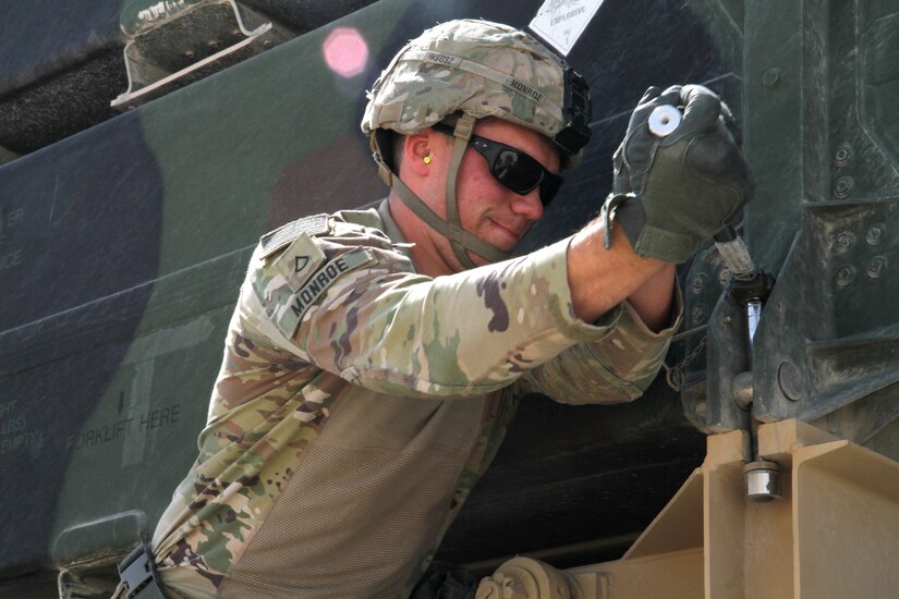 Army Pfc. Mark Monroe, a Hot Crew member with Battery C, 1st Battalion, 43rd Air Defense Artillery Regiment, uses a socket wrench to loosen a bolt duringa Patrior missile reload drill March 7, 2019. The Soldiers continually train and conduct battle drills to ensure they are able to perform their duty in providing air defense support across the U.S. Central Command area of responsibility.